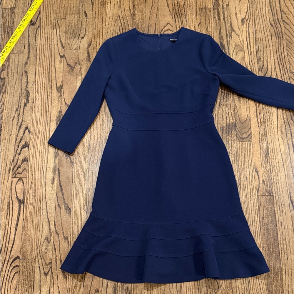 Maggy London Navy Blue cocktail Dress with ruffle at the hem. Wore once.